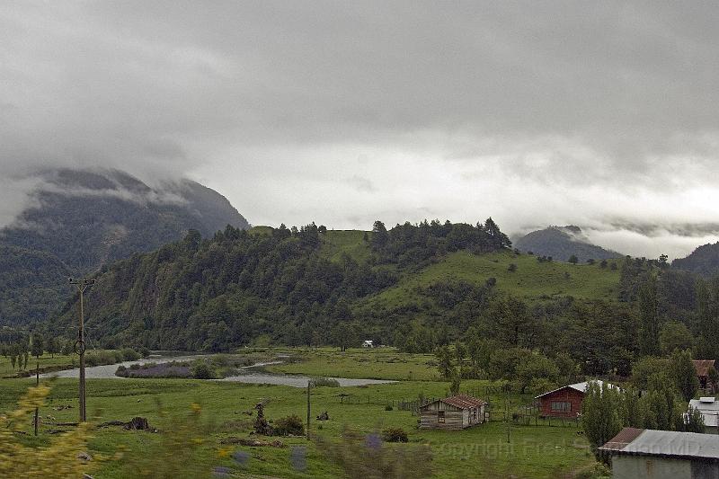 20071218 091217 D2X 4200x2800.jpg - Along the Carretera Austral Roadway from Puerto Chicabuco to Coyhaique a distance of abut 40 miles, the mist hangs low as dozens of rivers and waterfalls wend their way through the rocky formations to the Rio Simpson